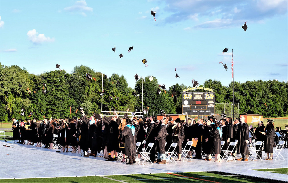 The traditional tossing to the graduation caps